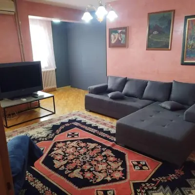 a living room with a couch and a tv at Dream 2 in Belgrade