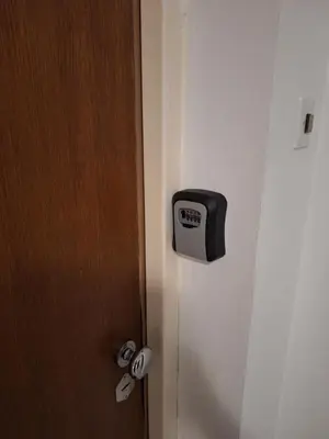 a door with a clock on the side of it at Dream 2 in Belgrade