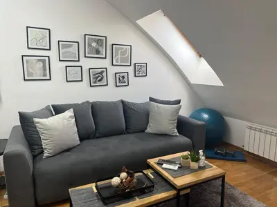 a living room with a couch and a table at City011 in Belgrade
