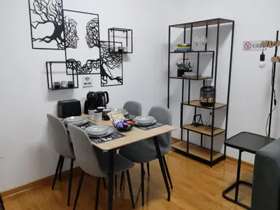 a dining room with a table and chairs at City011 in Belgrade