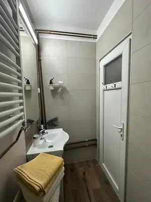 a small bathroom with a sink and a mirror at OASIS IN CENTER OF VRACAR in Vračar (historical)