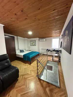 a room with a bed and a glass floor at OASIS IN CENTER OF VRACAR in Vračar (historical)