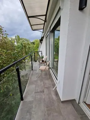 a balcony with a view of the water at Royal apartment Sava river Blok 70 in Ada Ciganlija