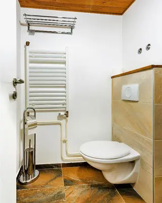 a bathroom with a white toilet and a sink at Arena Penthouse Apartments in Belgrade