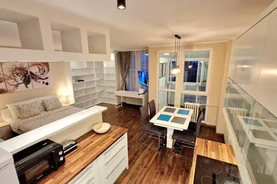 a large living room with a couch and a table at Apartman Meri in Tošin Bunar