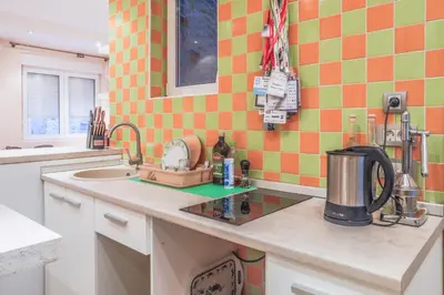 a kitchen with a sink and a counter top at Tesla Museum Residence in Belgrade