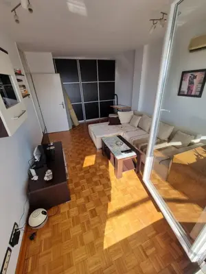 a living room with a couch and a table at Ušće apartman in Novi Beograd