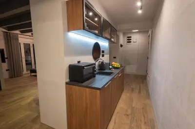 a kitchen with a sink and a microwave at Apartment Knez Belgrade in Belgrade