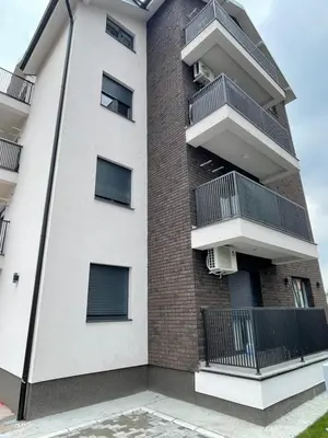 an apartment building with balconies on the side of it at Cvetanov trg LUX 3 in Belgrade