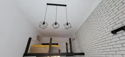 a room with a bed and a brick wall at Belgrade City Center Apartment in Belgrade