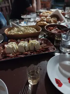 a table with a bunch of food on it at Etno domaćinstvo Miris Bosiljka in Mislođin