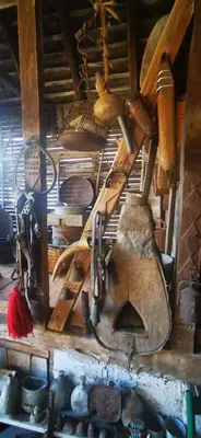 a bunch of tools are hanging on a wall at Etno domaćinstvo Miris Bosiljka in Mislođin