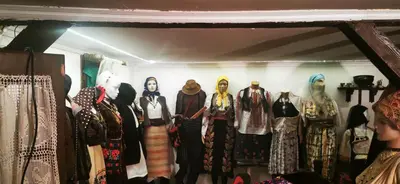 a group of women in traditional clothing in a store at Etno domaćinstvo Miris Bosiljka in Mislođin
