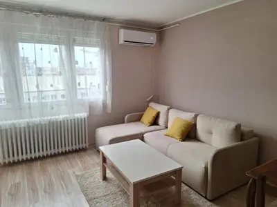 a living room with a couch and a table at Sarajevska Beograd in Sajmište