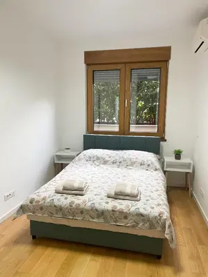 a bedroom with a bed with two pillows on it at Hedonist-Modern Urban Stay A Blok in Belgrade
