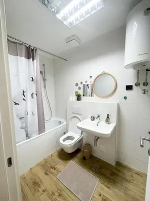 a bathroom with a toilet and a sink at Hedonist-Modern Urban Stay A Blok in Belgrade