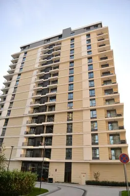 a large apartment building with balconies at Apartman IrMa in Sajmište