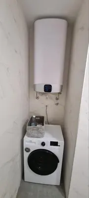 a kitchen with a white stove with a light above it at New luxury suite near St Sava Temple with garage in Belgrade