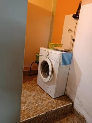 a washer and dryer sitting in a room at Maravilja in Filmski Grad