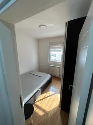 a small room with a bed and a window at Delete 44 in Novi Grad