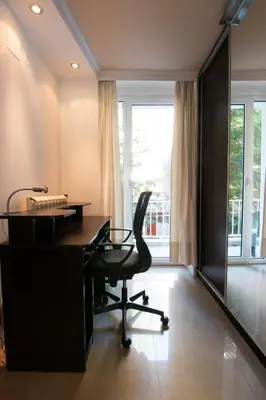 an office with a desk and a chair and a window at Sweet House Parlament Lux in Belgrade