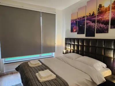 a bedroom with a large bed with a large window at Ramonda Belgrade Waterfront - BW Aqua in Belgrade