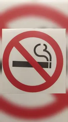 a no smoking sign on a red background at BGholik studio apartment in Belgrade