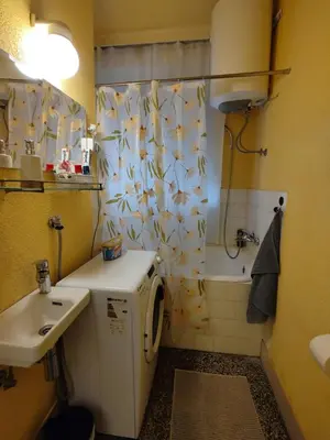 a bathroom with a sink and a toilet and a shower at BGholik studio apartment in Belgrade