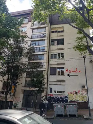 a building with graffiti on the side of it at BGholik studio apartment in Belgrade