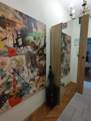 a room with a large painting on the wall at BGholik studio apartment in Belgrade