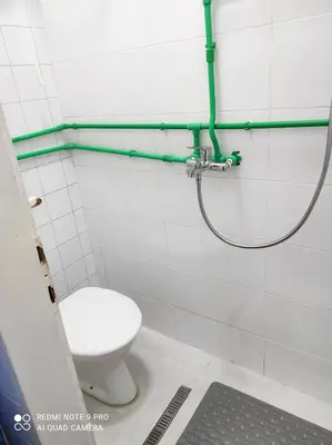 a bathroom with a toilet and a shower at Fair and Share Apt 1-7 guests in Belgrade