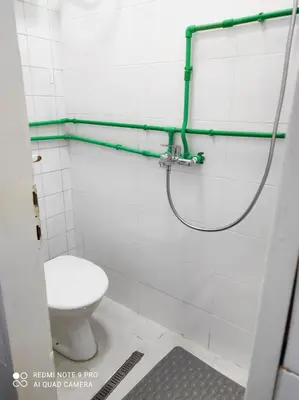 a bathroom with a toilet and a shower at Fair and Share Apt 1-7 guests in Belgrade