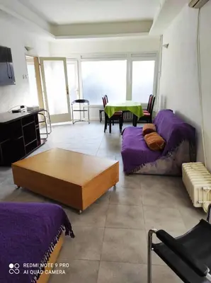 a living room with a couch and a table at Fair and Share Apt 1-7 guests in Belgrade