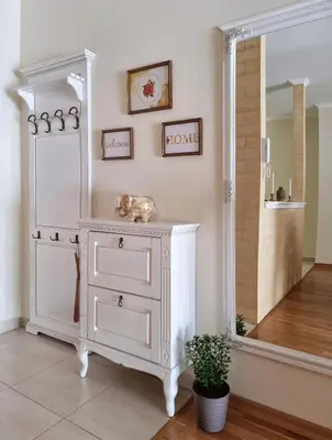 a white dresser in a room with a mirror at Antik Apartman in Stara Pazova