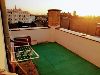 a balcony with a green floor on a building at Belgrade River view 1 in Belgrade