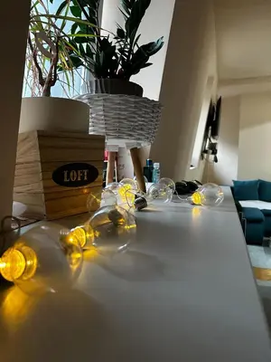 a table with wine glasses on top of it at Cozy loft in Belgrade