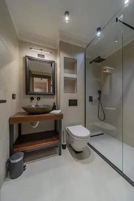 a bathroom with a toilet and a sink and a shower at Passpartu Apartments in Belgrade