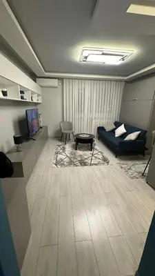 a living room with a couch and a table at Apartman Film City in Žarkovo