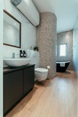 a bathroom with a sink and a toilet and a tub at Biarritz Luxury Apartments in Belgrade