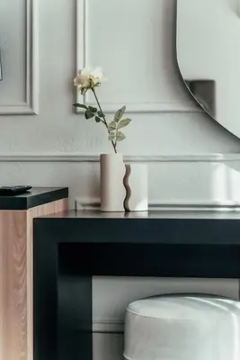 a white flower in a vase on a table at Biarritz Luxury Apartments in Belgrade