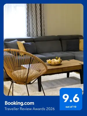 a living room with a couch and a coffee table at AeroVista Apartment in Surčin