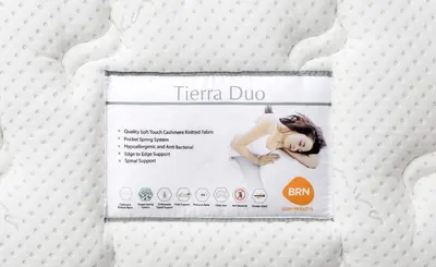 a sign on a bed with the words terra dub at AeroVista Apartment in Surčin