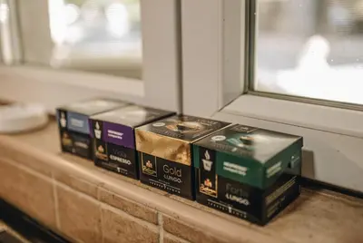 three boxes sitting on a counter near a window at Apartman Premijer 1 in Čukarica