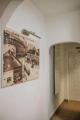 a picture of a city on a wall in a hallway at Apartman Premijer 1 in Čukarica