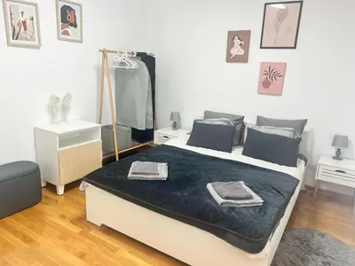 a bedroom with a bed with a mirror on it at BeoCity 011 in Novi Beograd