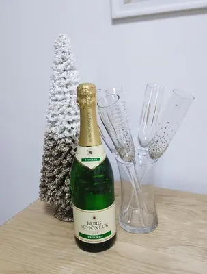 a bottle of champagne and two wine glasses on a table at BeoCity 011 in Novi Beograd