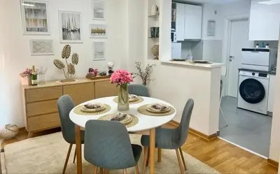 a kitchen and dining room with a table and chairs at BeoCity 011 in Novi Beograd