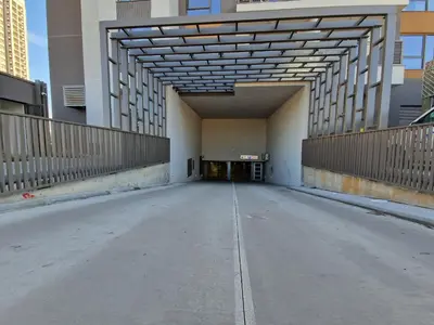 an empty parking lot in a building with a large ceiling at Aqua Royal BW apartment in Sajmište