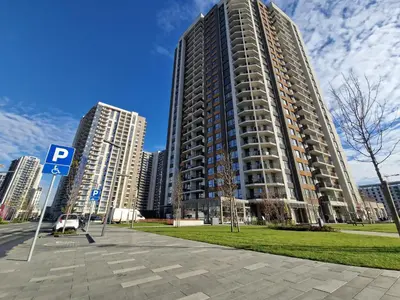 a large apartment building in a city with tall buildings at Aqua Royal BW apartment in Sajmište