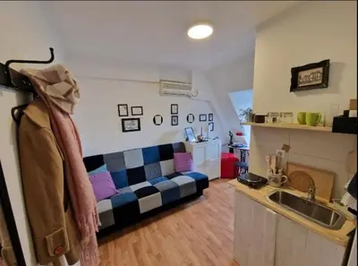 a living room with a couch and a sink at Srce Beograda in Belgrade